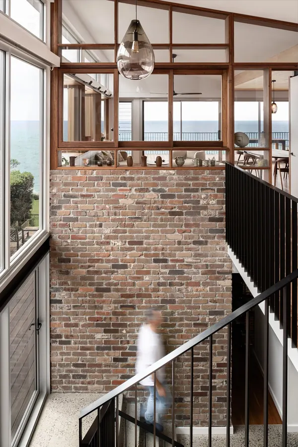 Recycled brick feature wall and timber stair at Wombarra Clifftops